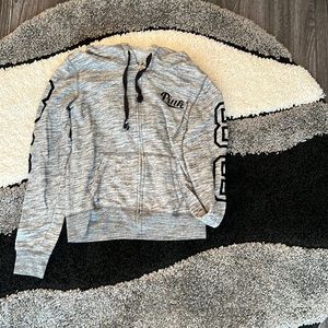 Size small, zip up hoodie. Velour black writing.